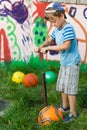 Boy inflates soccer ball pump Royalty Free Stock Photo