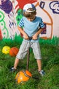 Boy inflates soccer ball pump Royalty Free Stock Photo