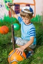 Boy inflates soccer ball pump Royalty Free Stock Photo