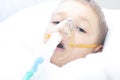 Boy with an inhaler mask - respiratory problems