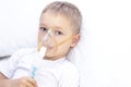 Boy with an inhaler mask - respiratory problems