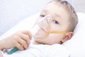 Boy with an inhaler mask - respiratory problems