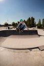 Boy with inline skates, rollerblade, doing a jump in a skate park Royalty Free Stock Photo