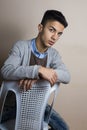 Boy itting on chair inside studio Royalty Free Stock Photo