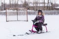 Boy in jacket walking in winter, ice skating, Royalty Free Stock Photo