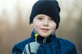 Boy in jacket walking in winter, ice skating, Royalty Free Stock Photo