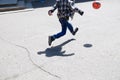 Boy in jump, child running after ball playing football on asphalt, ball jump,soccer team player, training outdoor Royalty Free Stock Photo