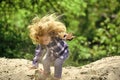 Boy jump on pile of sand on idyllic day Royalty Free Stock Photo