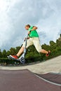 Boy jumping in the air with his Royalty Free Stock Photo