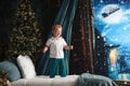 Boy jumping on bed at Christmas Royalty Free Stock Photo