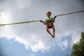 The boy is jumping on a bungee trampoline. A child with insuranc Royalty Free Stock Photo