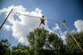 The boy is jumping on a bungee trampoline. A child with insuranc