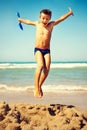 Boy jumping freedom in the beach Royalty Free Stock Photo