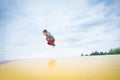 Boy jumping high on a outdoor trampoline