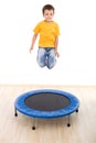 Boy jumping high on trampoline Royalty Free Stock Photo