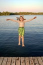 Boy jumping into lake Royalty Free Stock Photo