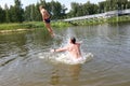 Boy jumping into lake Royalty Free Stock Photo
