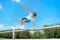 boy jumping over the fence. Sports and activities for young people. Childhood and leisure. Freedom and happy people. Royalty Free Stock Photo