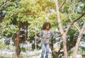 Boy jumping over the rope in the park on sunny summer day. Royalty Free Stock Photo