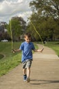 Boy Jumping Rope in the Park Royalty Free Stock Photo