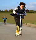 Boy jumping on scooter