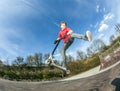 Boy jumping with a scooter