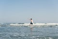 Boy Jumping In Sea Waves with Water Splashes. Concept