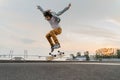 Boy jumping on skateboard at the street Royalty Free Stock Photo