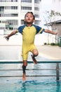 Boy Jumping Into Swimming Pool Royalty Free Stock Photo