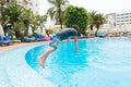 Boy jumping into swimming pool Royalty Free Stock Photo