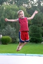 Boy Jumping on Trampoline Royalty Free Stock Photo