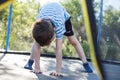 Boy jumping on trampoline. the child plays on a trampoline Royalty Free Stock Photo