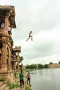 Boy jumps from Sarkhej Roza, Ahmedabad, India.