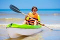 Boy on kayak in tropical sea. Kid in canoe Royalty Free Stock Photo