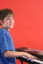 Boy on keyboard left vertical Royalty Free Stock Photo