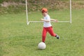 Little boy kicking ball in the park. playing soccer football in the park. Sports for exercise and activity. Royalty Free Stock Photo