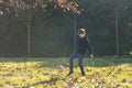 A boy is kicking a soccer ball in a park Royalty Free Stock Photo