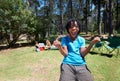 Boy kid, cheers outdoor and fun at summer camp, happiness and celebration with smile in portrait. African kid in nature