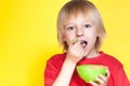 Boy kid child eating corn flakes cereal Royalty Free Stock Photo