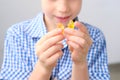 Boy, kid holding sweets in his hands, gummy bear, concept of children`s delicacy, healthy and unhealthy food, halal food