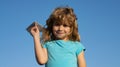 Boy kid with paper plane on summer day. Child dreaming, throwing paper plane, toy airplane. Royalty Free Stock Photo