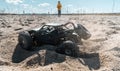 Boy kid playing radio control car riding on sand outdoor enjoying happy childhood Royalty Free Stock Photo