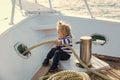 Boy kid playing with rope on yacht Royalty Free Stock Photo