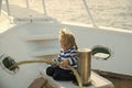 Boy kid playing with rope on yacht Royalty Free Stock Photo