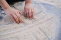 Boy kid playing with sand on the playground, the concept of the development of fine motor skills, tactile sensations, creativity,