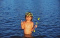 Boy kid swim on the beach on summer holidays. Child in sea. Happy kids swimming in the water. Little boy swimming in Royalty Free Stock Photo