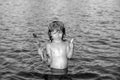 Boy kid swim on the beach on summer holidays. Child in sea. Happy kids swimming in the water. Little boy swimming in Royalty Free Stock Photo