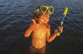 Boy kid swimming on the beach on summer vacation. Child in sea. Happy children swimming and snorkeling in tropical ocean Royalty Free Stock Photo