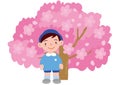 A boy kindergartener in front of a cherry tree in full bloom Royalty Free Stock Photo