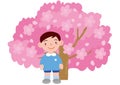 A boy kindergartener in front of a cherry tree in full bloom Royalty Free Stock Photo